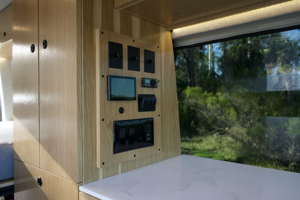 Maple cabinetry and the Victron control panel inside the Drifter