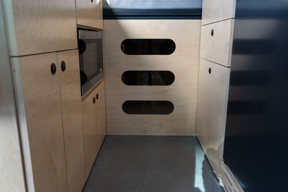 Maple cabinetry with routed slot handles