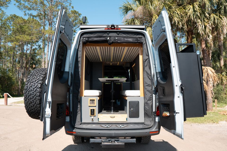 A Sprinter 170 Extended with its rear doors open to a gear garage