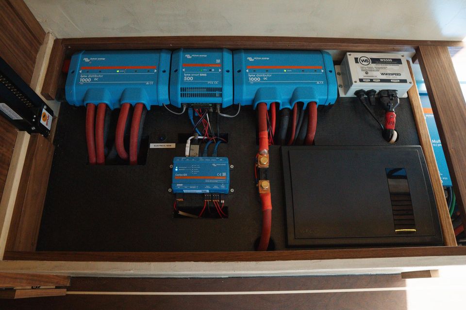A Victron electrical bay with inverters and battery monitor