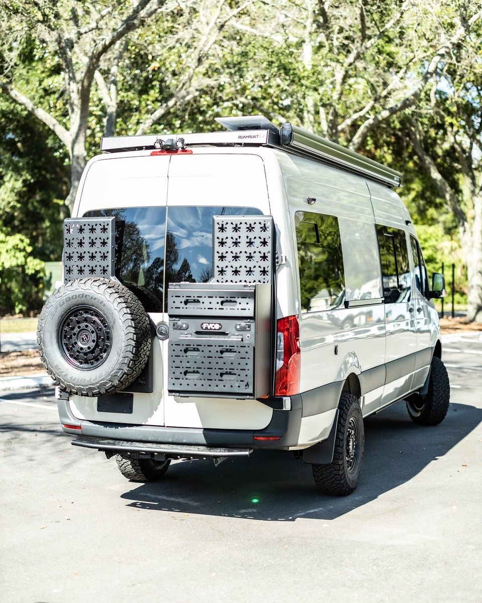 A Sprinter from the rear with a tire carrier and ladder