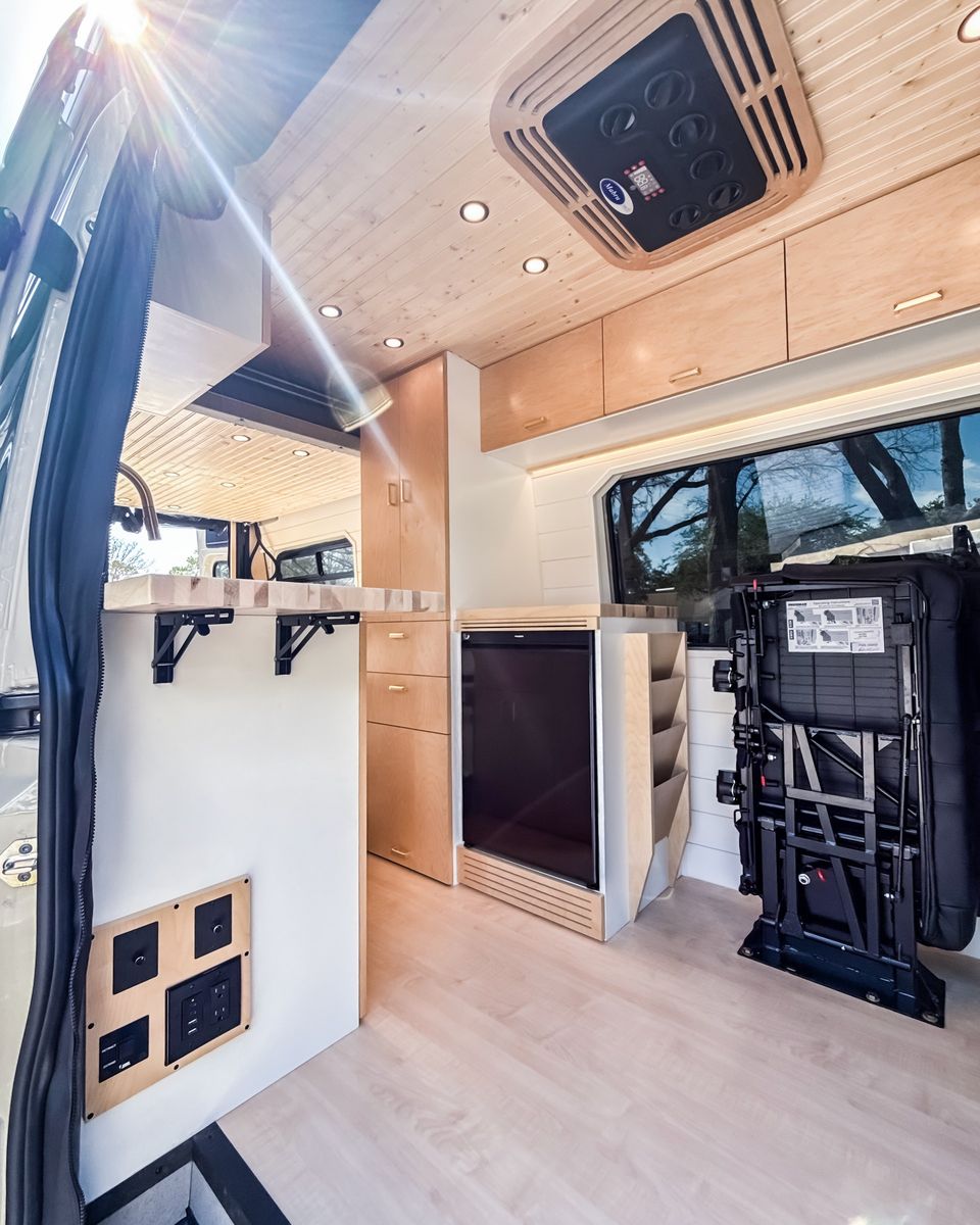 A light wood interior looking toward the cab