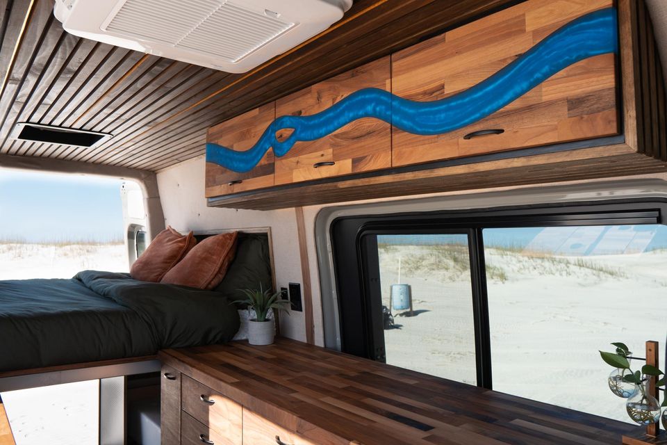 Custom cabinetry with a blue river inlay over the bed