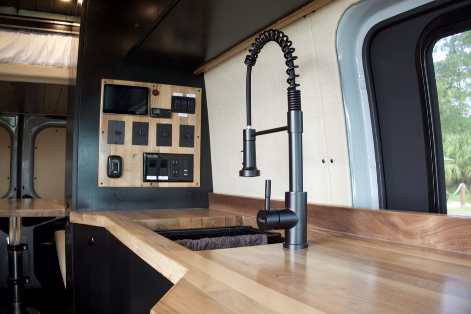 The Gamer Van galley sink next to the Victron control panel