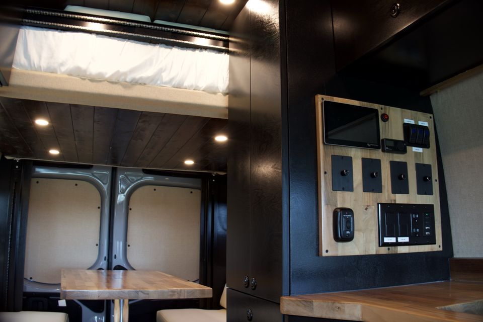 The Gamer Van Victron touchscreen panel with the elevator bed raised
