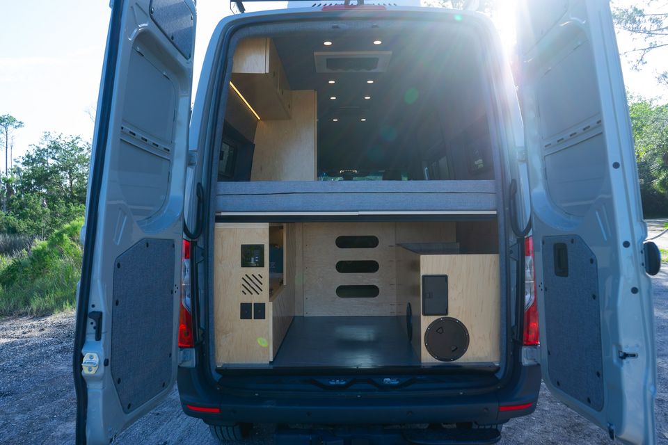 Kai, a gray 2026 Drifter, with its rear doors open to the gear garage