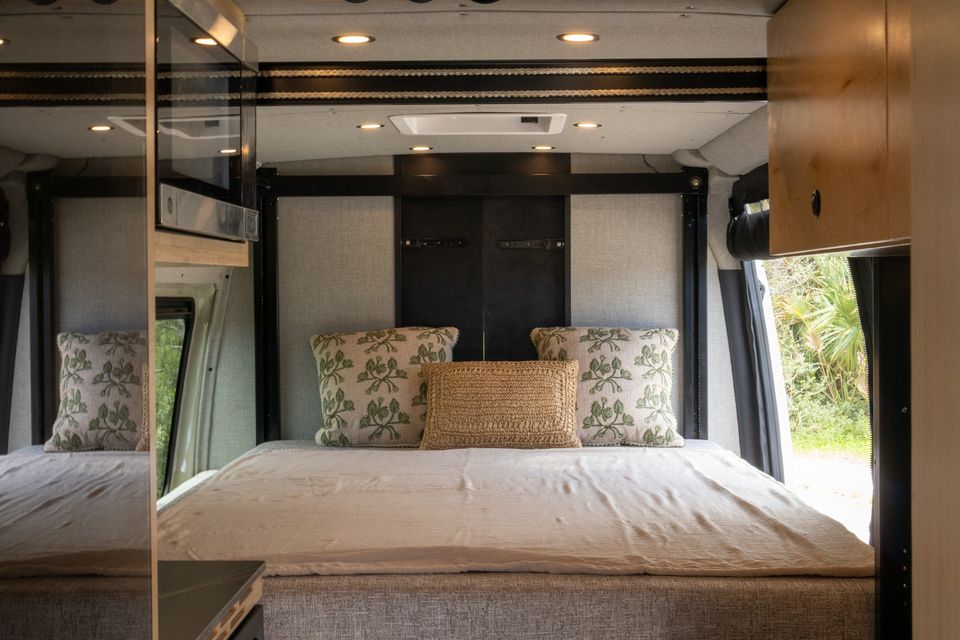 The Oasis motorized elevator bed lowered and made up