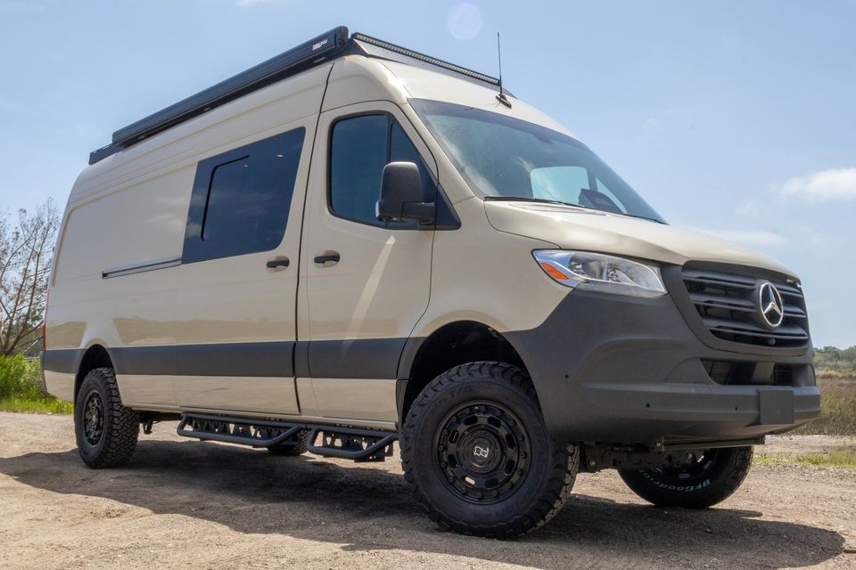 The Oasis exterior with side steps, ladder and roof rack