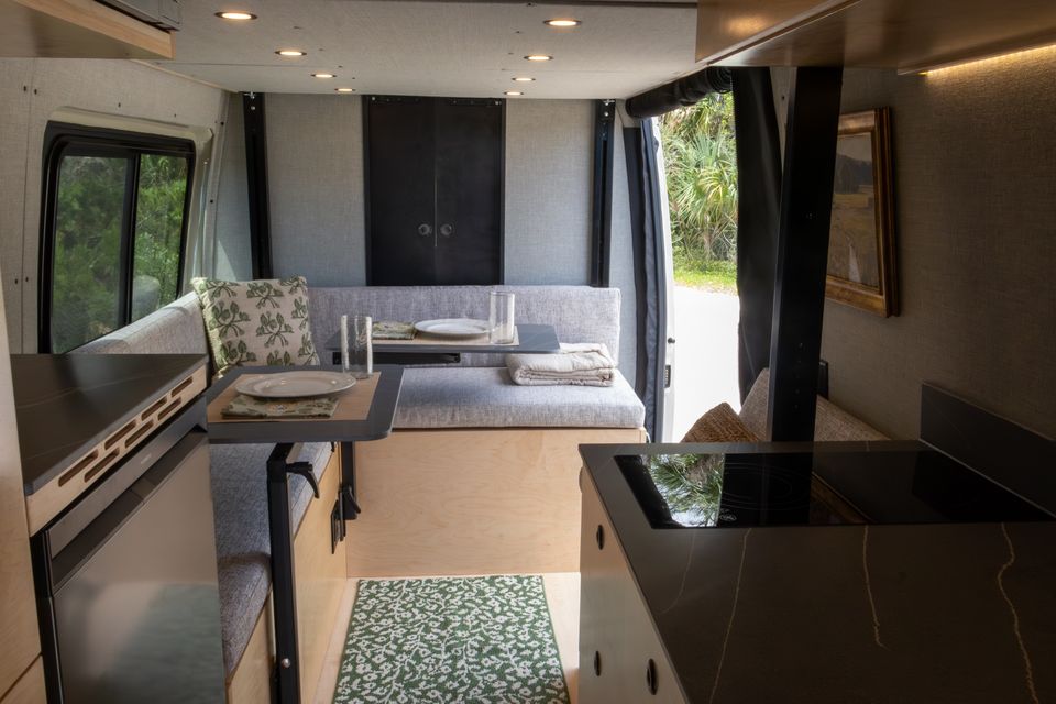 The Oasis L-shaped lounge with two tables