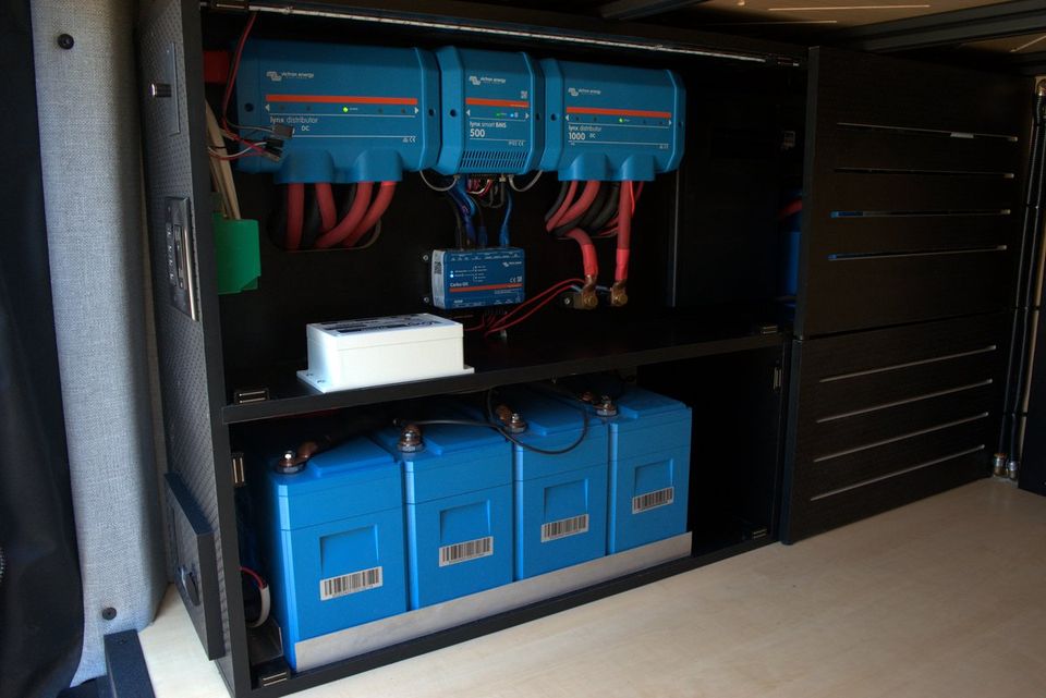 Victron inverters, chargers and lithium batteries in a van electrical bay